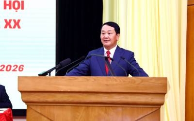 Ông Hầu A Lềnh, Uỷ viên Trung ương Đảng, Bí thư Tỉnh uỷ Tuyên Quang, trình bày chương trình hành động tại Hội nghị. Ảnh: Quang Cường - TTXVN